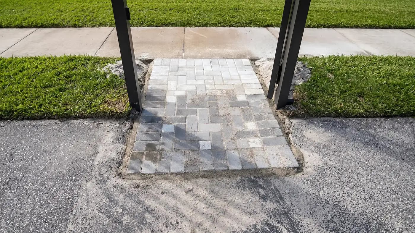 Grey herringbone paver walkway